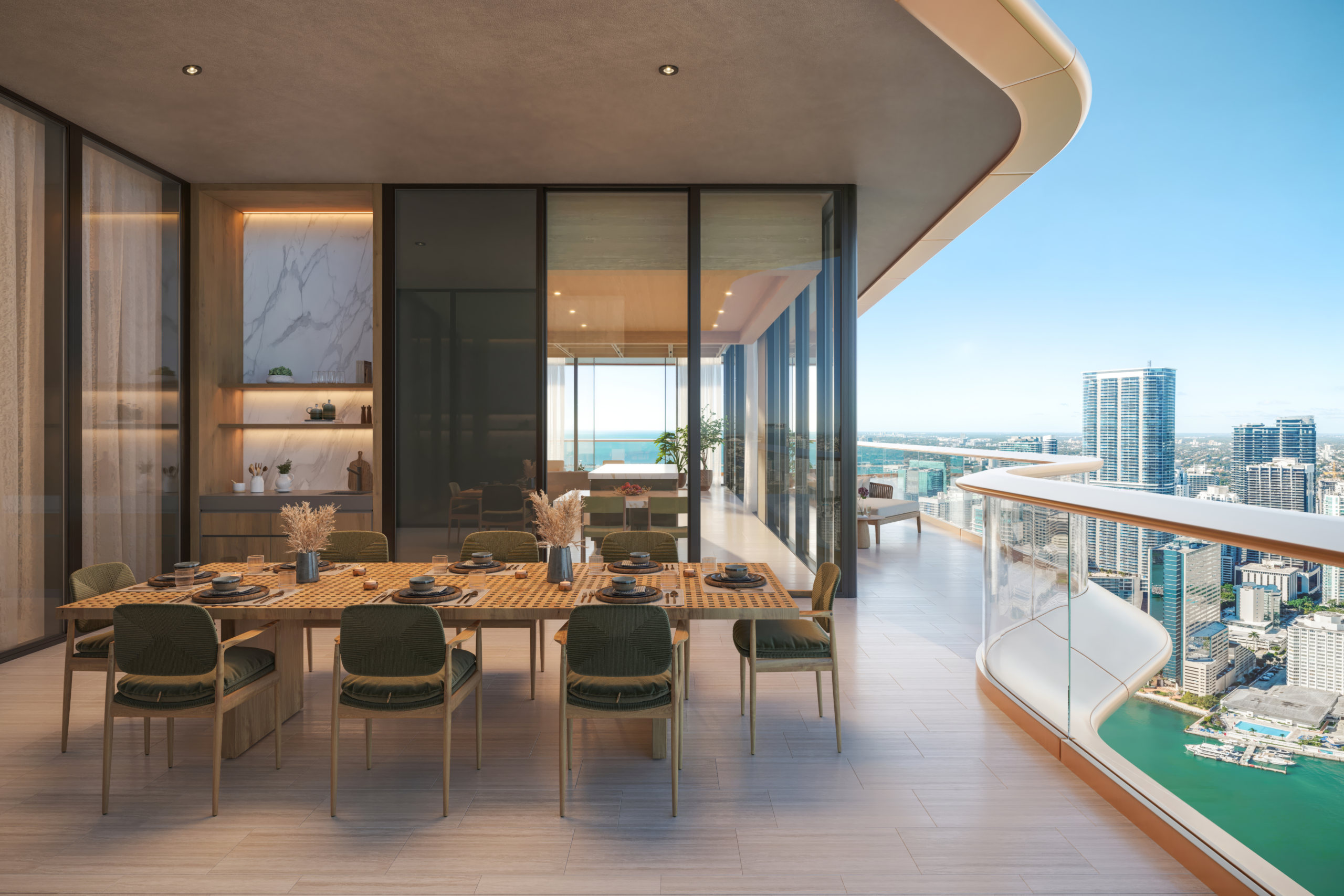 Luxury residence living and dining area with expansive private terrace and Biscayne Bay views at The Residences at Mandarin Oriental, Miami.