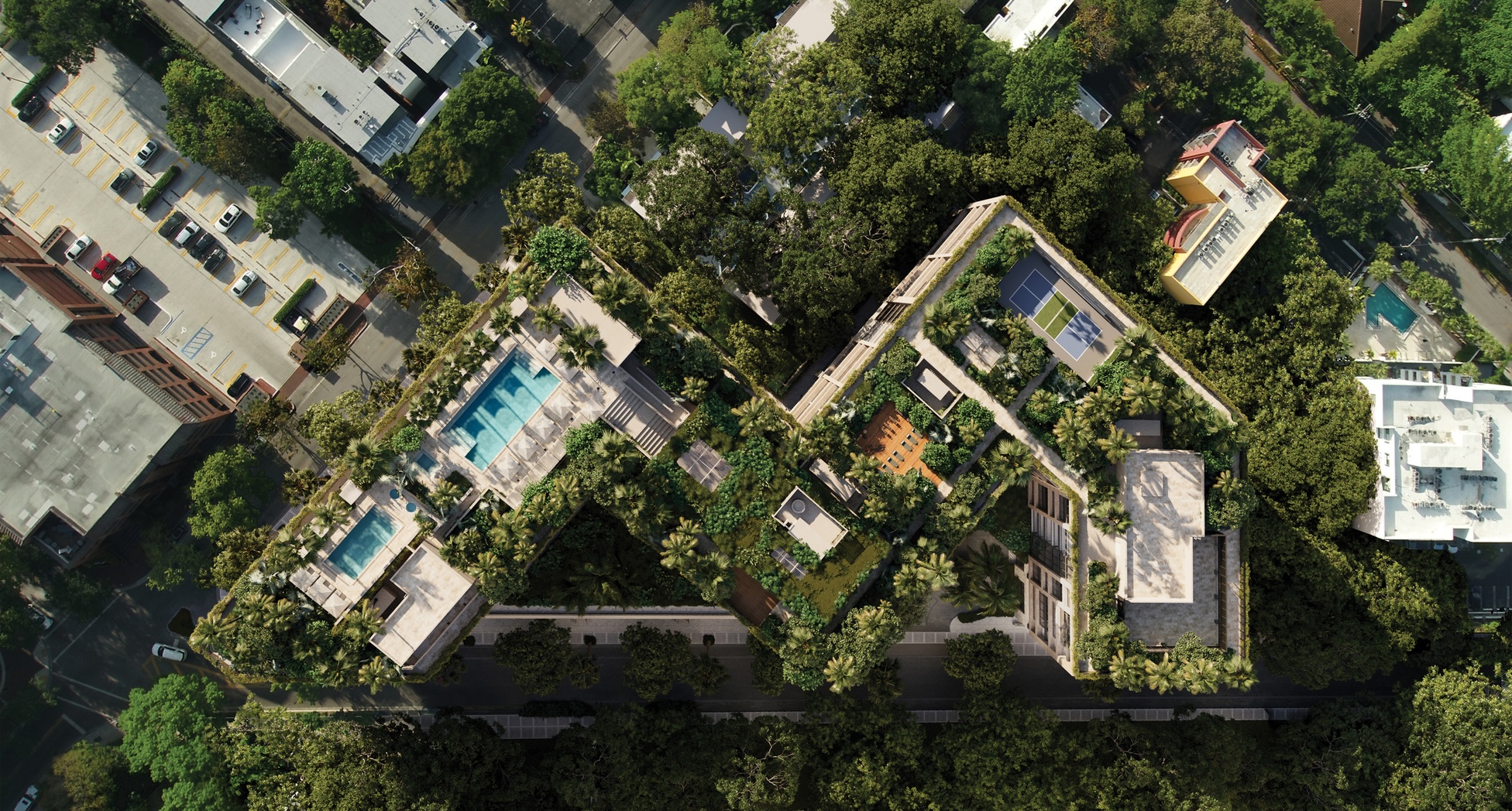 Aerial view of The WELL Coconut Grove surrounded by mature tree canopy in Florida
